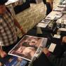 Derrik Lewis autographing a poster