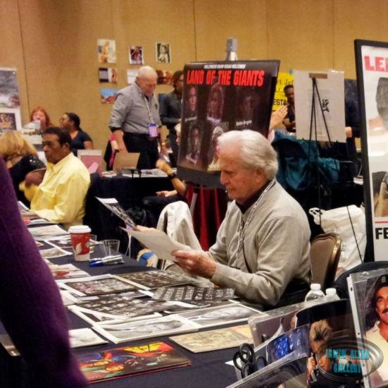 Don Matheson with Giants Log Folder on Table