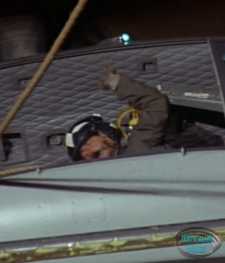 Man Firing Line from Helicopter